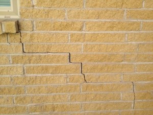 Photo showing diagonal cracks in brick wall